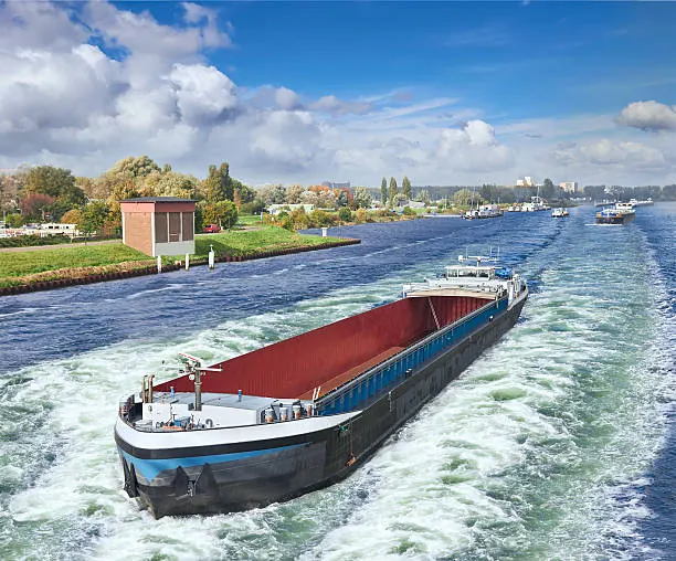 An inland barge under way on the Amsterdam–Rhine canal